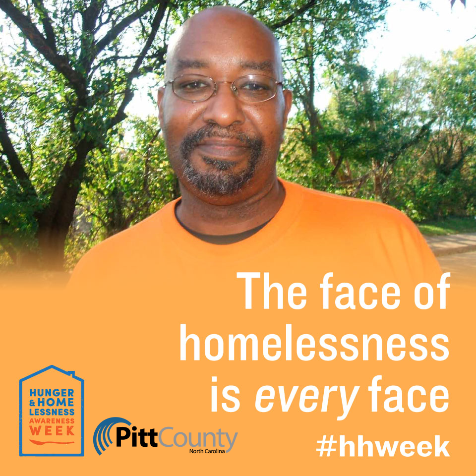 Man with glasses smiling